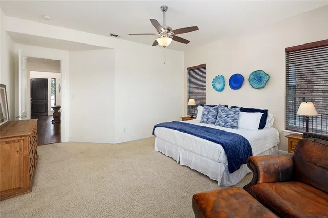 a bedroom with bed couch and window
