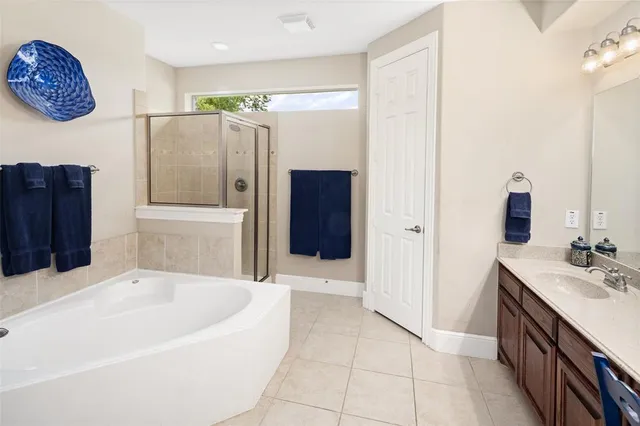 a bathroom with a bathtub and a sink