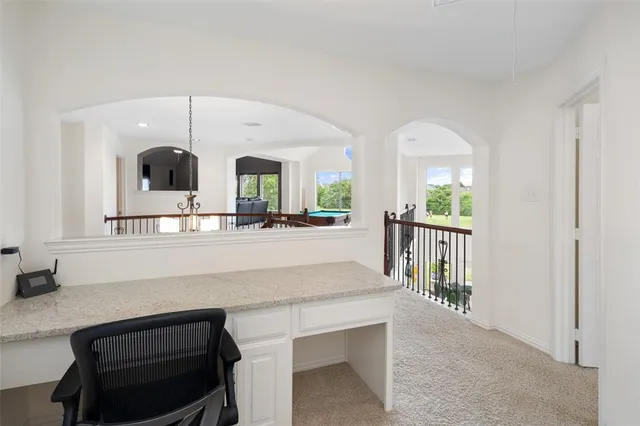 a living room with a sink and a mirror