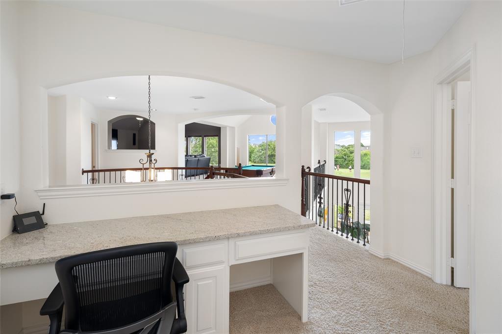 2801 Meadow Ridge Drive Prosper, TX 75078 - Photo 31 of 40 a living room with a sink and a mirror