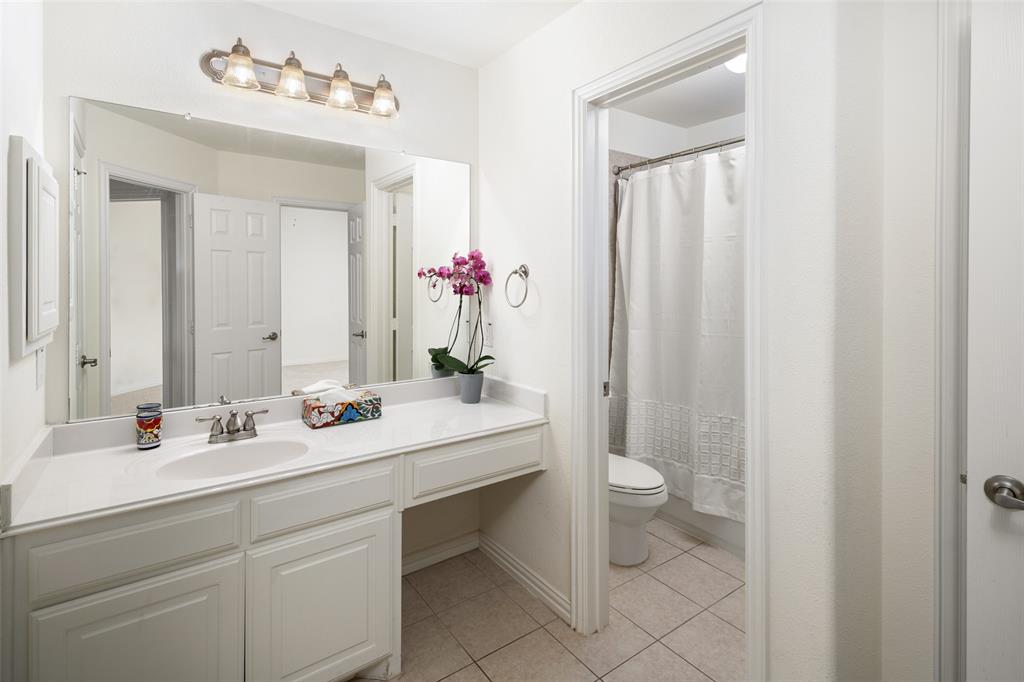 2801 Meadow Ridge Drive Prosper, TX 75078 - Photo 32 of 40 a bathroom with a sink and a mirror