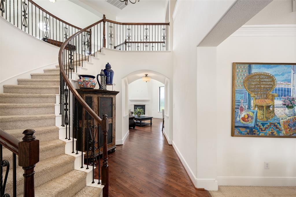 2801 Meadow Ridge Drive Prosper, TX 75078 - Photo 4 of 40 a view of entryway and hall with wooden floor
