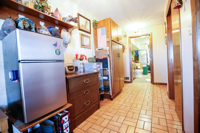 a kitchen with a refrigerator and a refrigerator