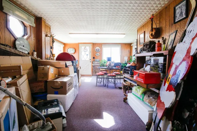 a outdoor dining space with a stove and a wooden floor