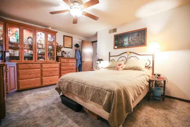 a living room with fireplace furniture and a flat screen tv