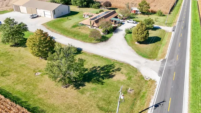 a view of a swimming pool with a yard