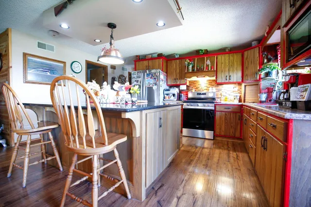 a view of a kitchen and dining room