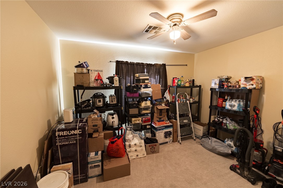4994 Mascaro Drive Las Vegas, NV 89122 - Photo 18 of 30 A versatile space featuring a ceiling fan, ideal for storage or future customization.