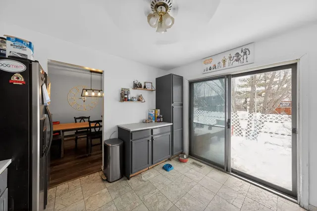a kitchen with stainless steel appliances granite countertop a refrigerator and a sink