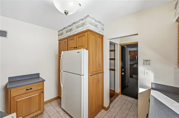 a hallway with storage and utility room