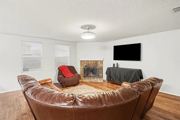 a bedroom with furniture and a flat screen tv