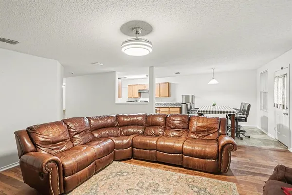 a living room with a couch and a window