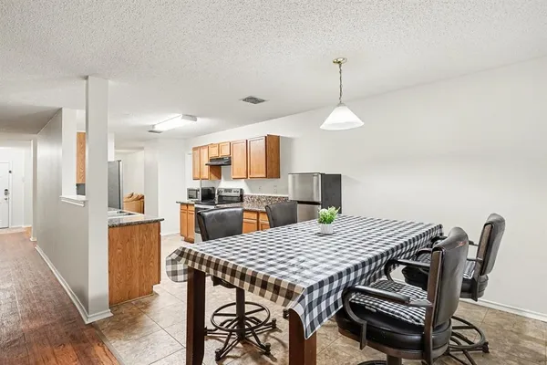 a view of a dining room with furniture