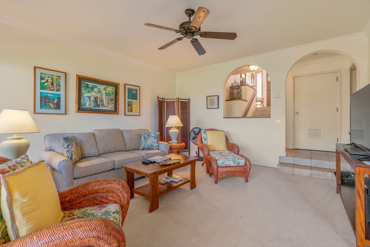 1901 Poipu Road, Unit 213 Koloa, HI 96756 - Photo 5 of 15 a living room with furniture and a mirror