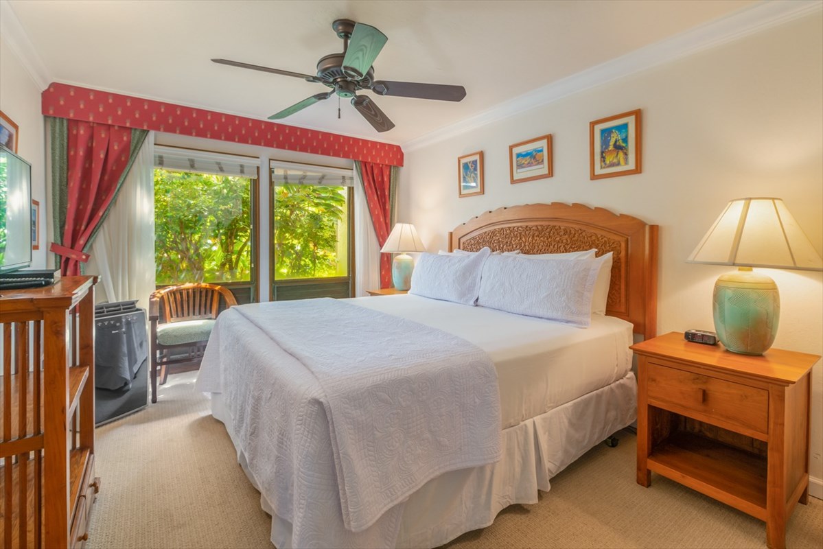 1901 Poipu Road, Unit 213 Koloa, HI 96756 - Photo 9 of 15 a bedroom with a large bed and a window
