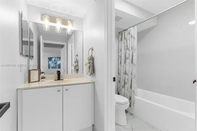 a bedroom with a bed and large window