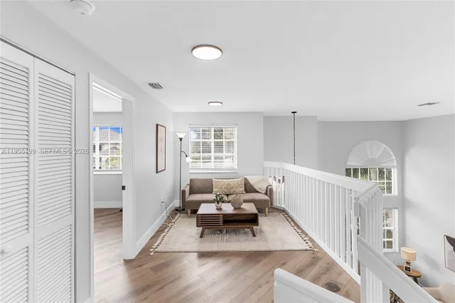 a bedroom with a bed and ceiling fan