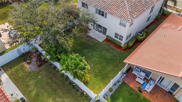 a view of a backyard with sitting area