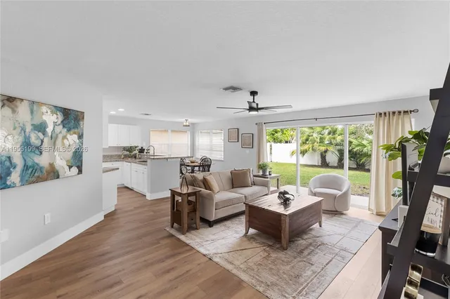 a kitchen with granite countertop a sink and cabinets