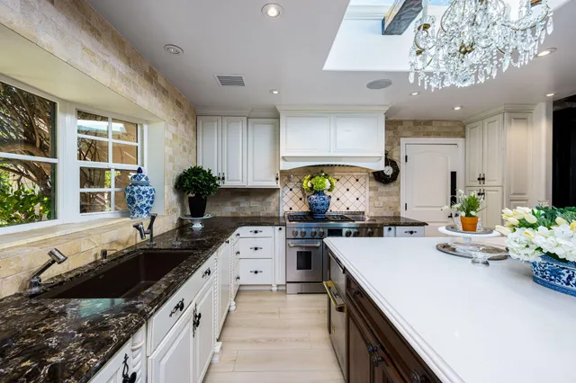 a kitchen with a sink stove and cabinets