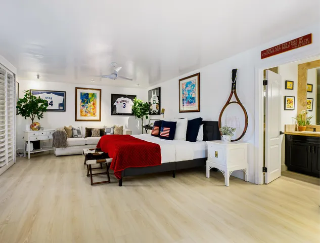 a bed room with a bed and a chair