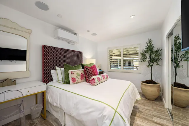 a room with a bed furniture and kitchen view