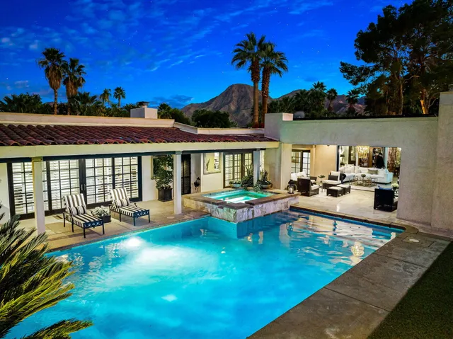 a view of a swimming pool with a patio