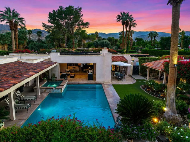 a view of house with outdoor space and mountain view