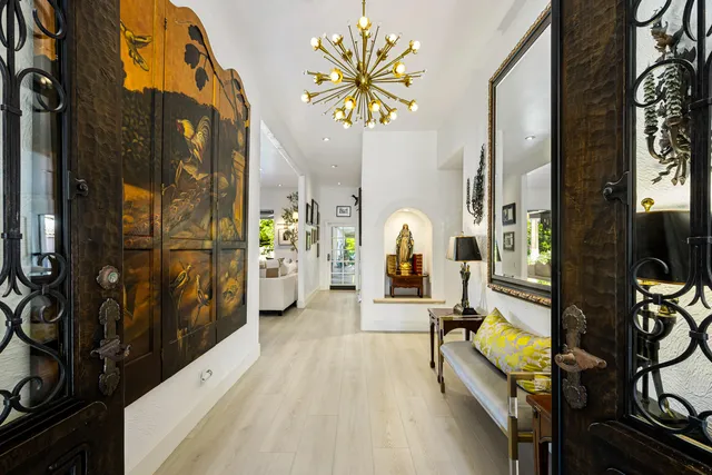 a view of living room with furniture and a fireplace