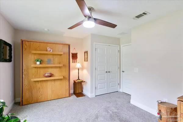 a view of an empty room and a window