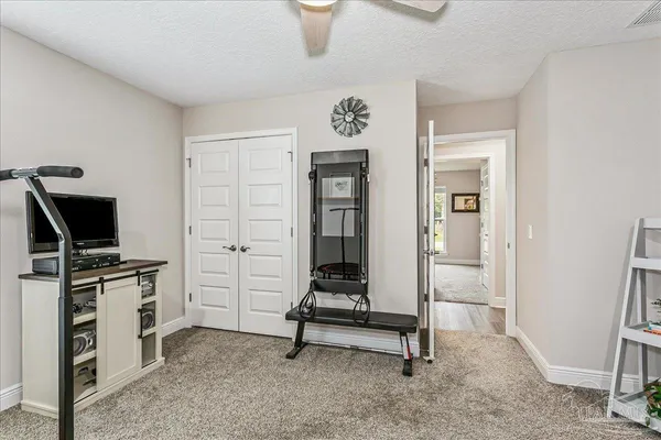 a view of a livingroom with furniture and a flat screen tv
