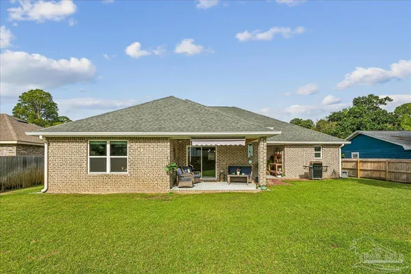 a front view of house with yard and green space