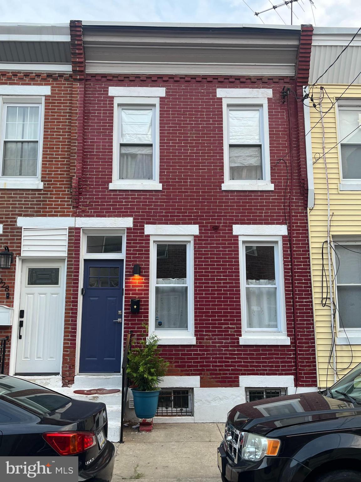 1930 Pierce Street Philadelphia, PA 19145 - Photo 15 of 16 a car parked in front of a brick house