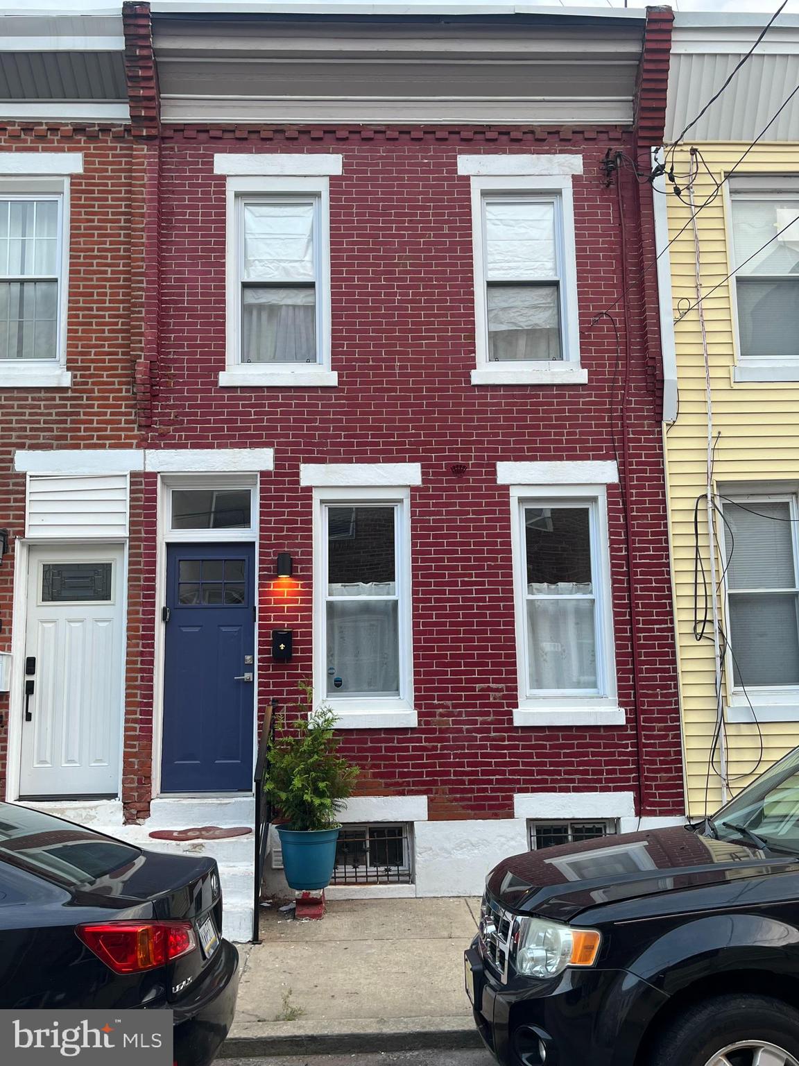 1930 Pierce Street Philadelphia, PA 19145 - Photo 16 of 16 a car parked in front of a brick building