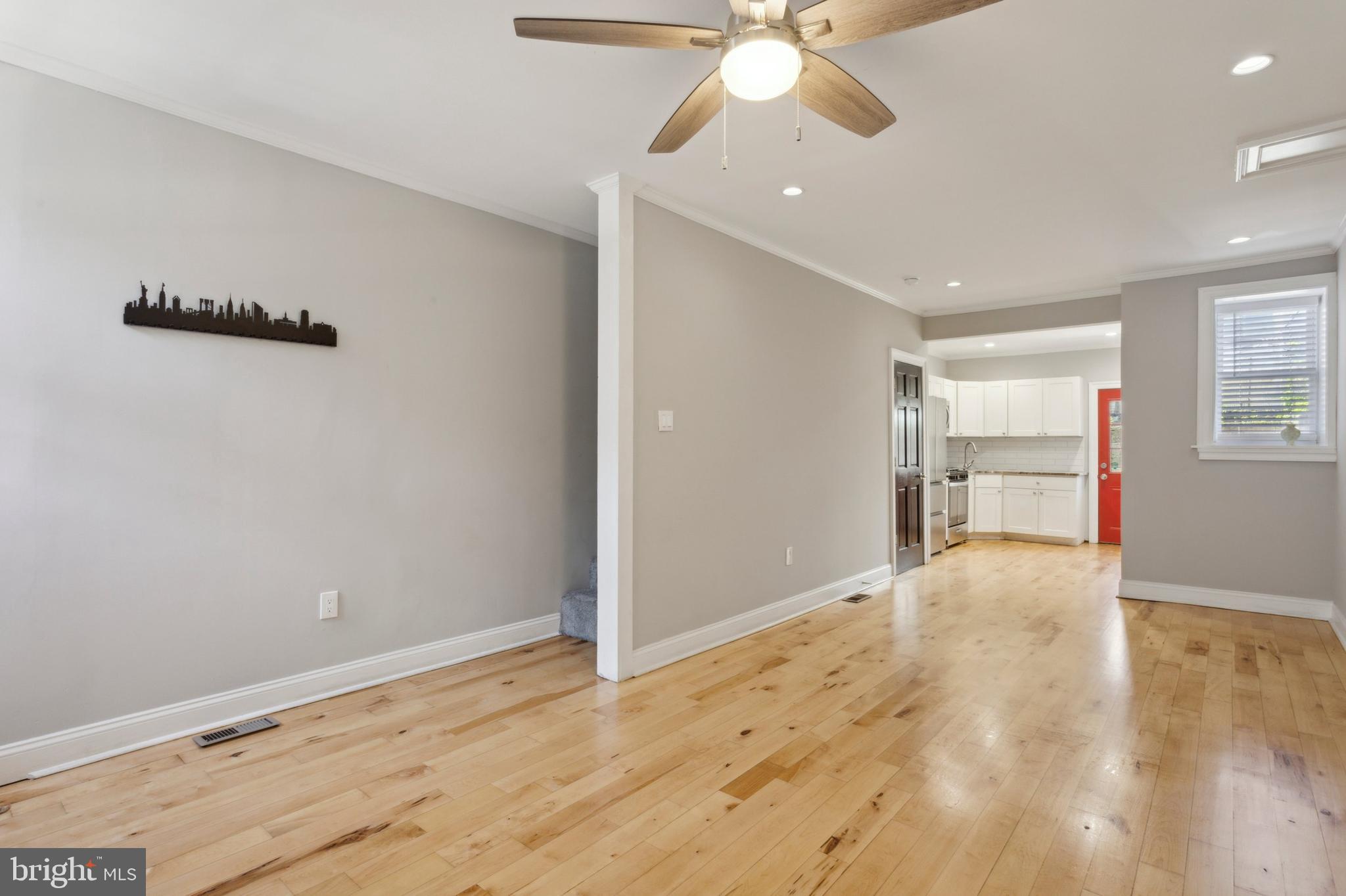 1930 Pierce Street Philadelphia, PA 19145 - Photo 3 of 16 an empty room with wooden floor fan and windows