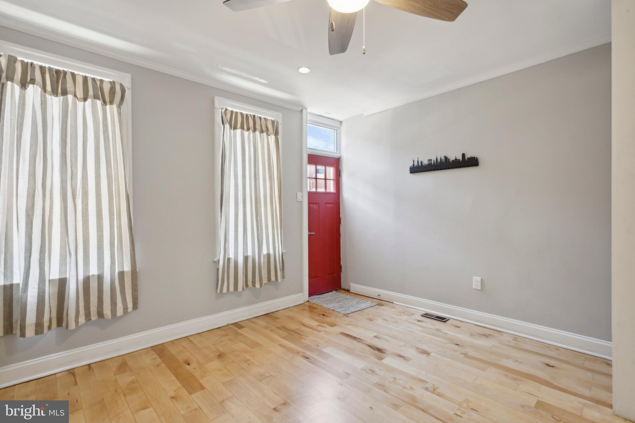 1930 Pierce Street Philadelphia, PA 19145 - Photo 4 of 16 a view of livingroom with hardwood floor and hallway