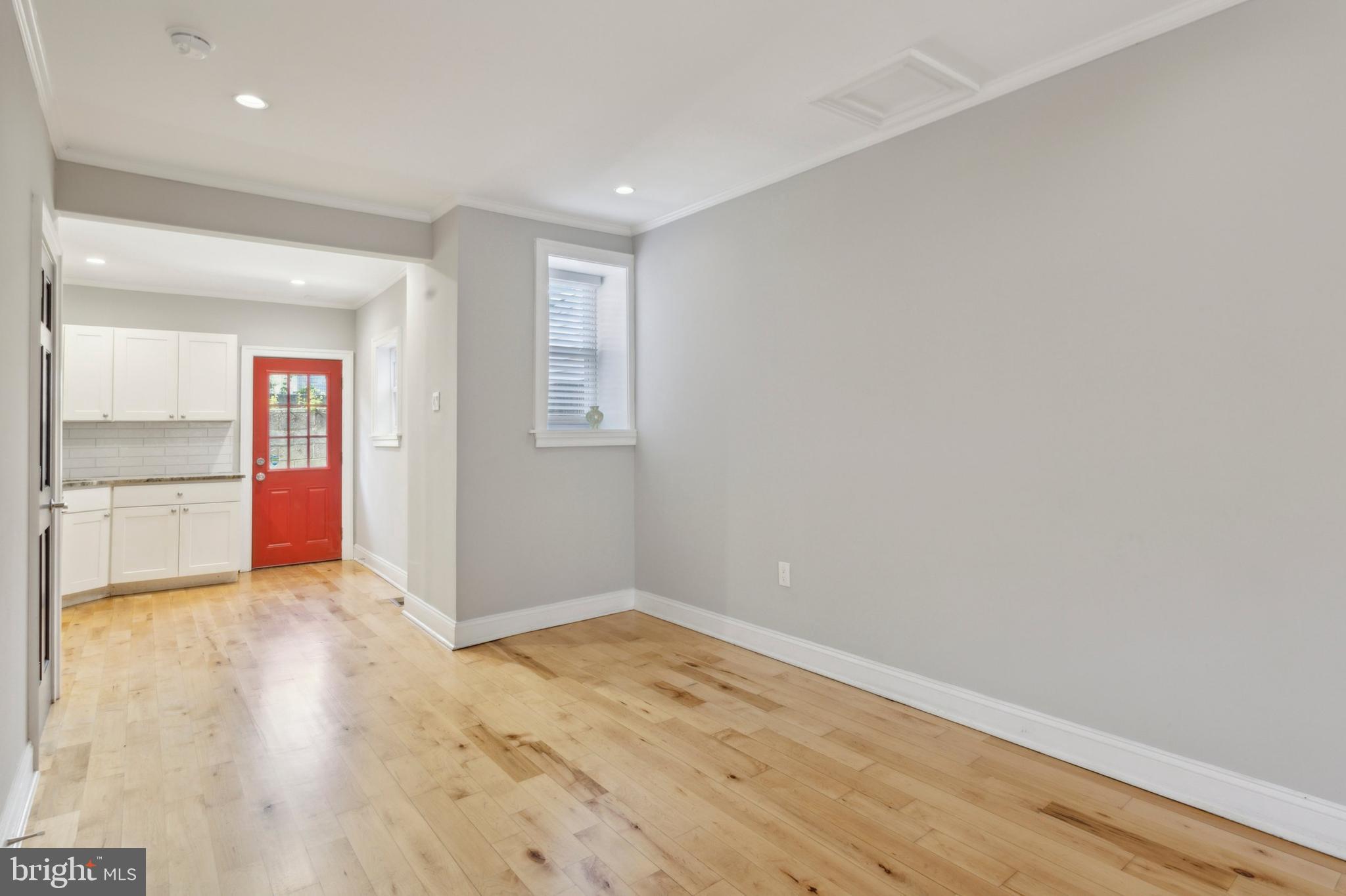 1930 Pierce Street Philadelphia, PA 19145 - Photo 5 of 16 an empty room with wooden floor and windows