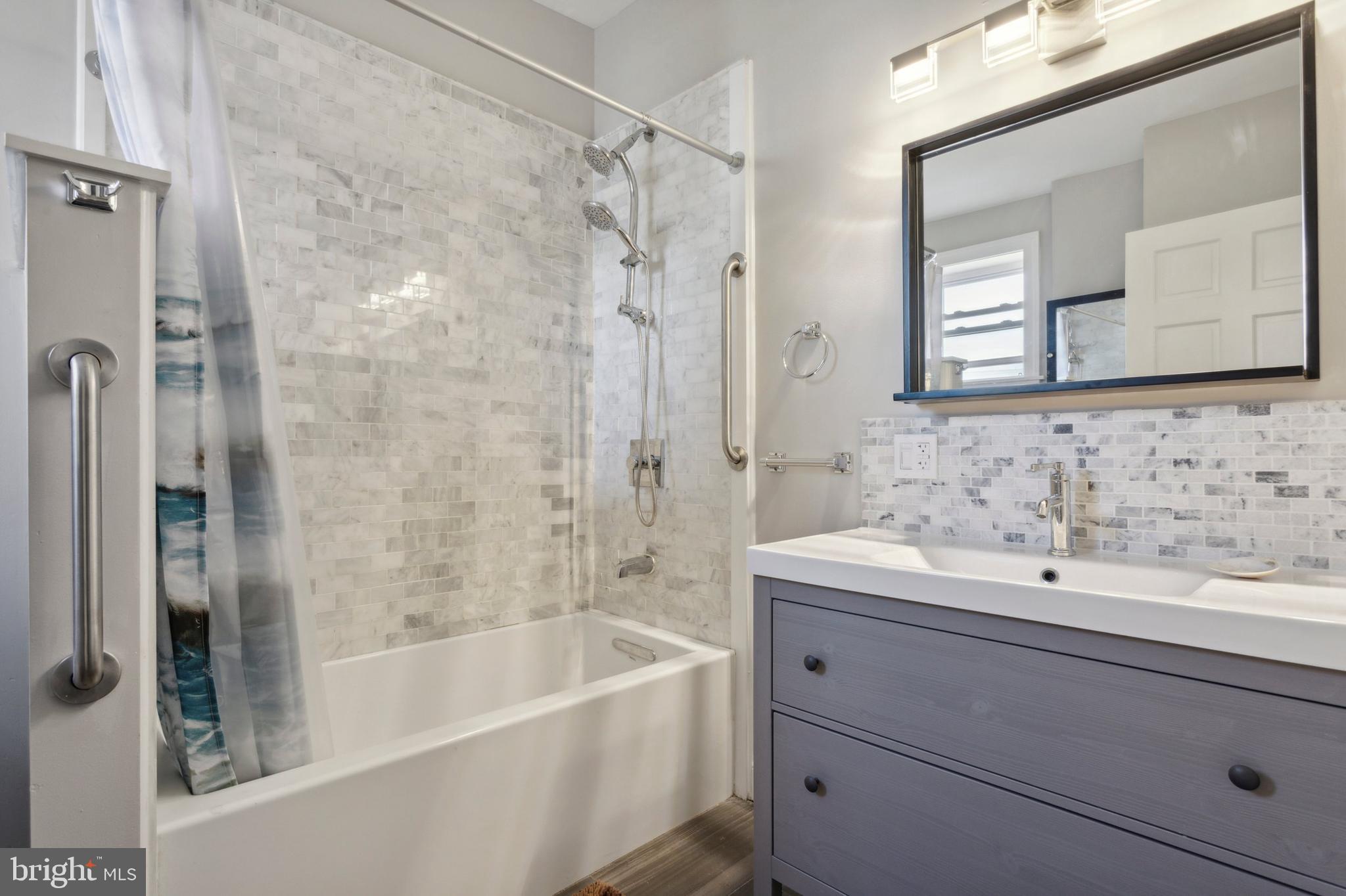 1930 Pierce Street Philadelphia, PA 19145 - Photo 7 of 16 a bathroom with a bathtub and a sink