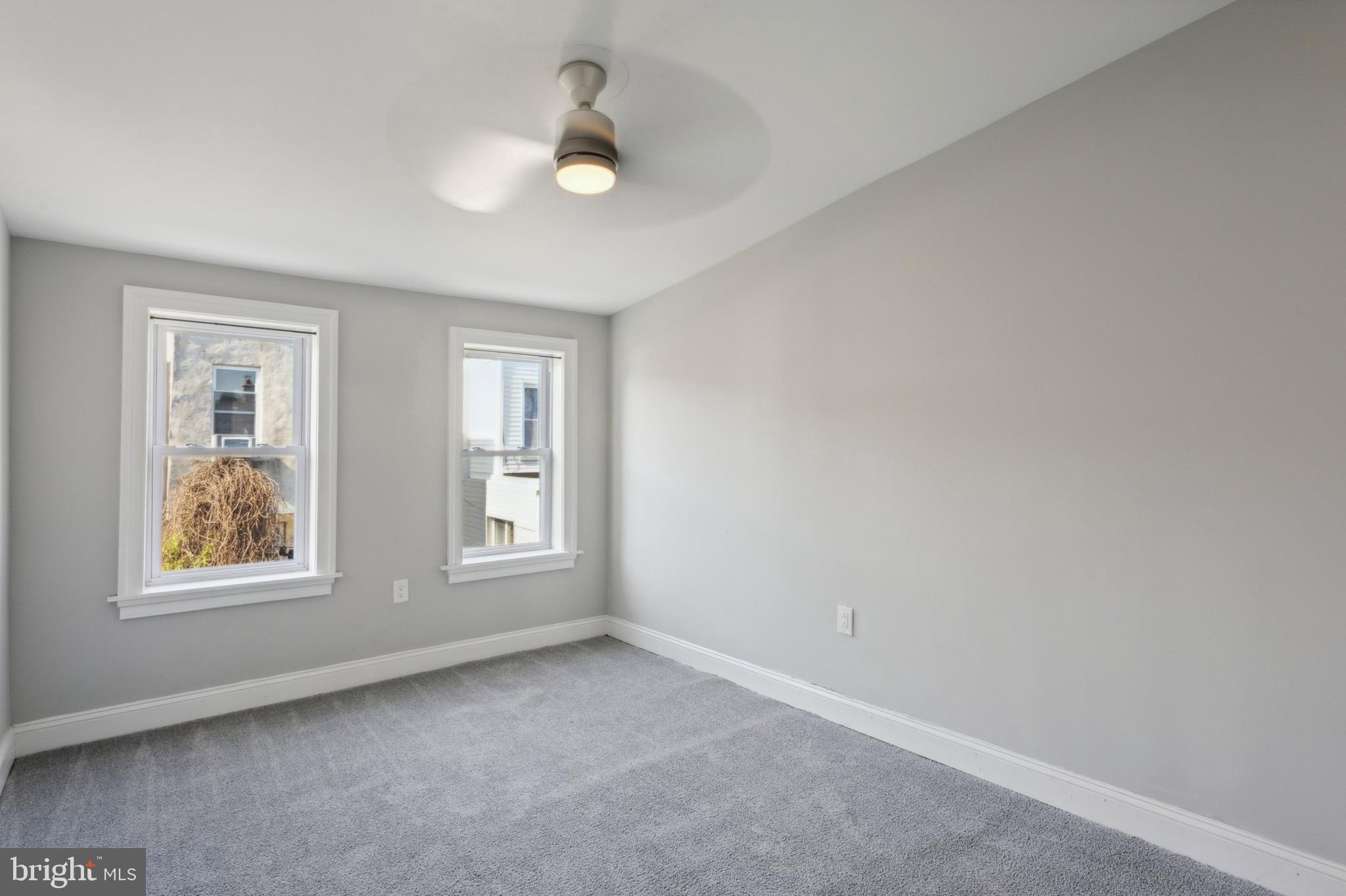 1930 Pierce Street Philadelphia, PA 19145 - Photo 10 of 16 an empty room with windows
