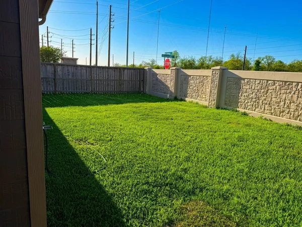 a view of a backyard with a tub