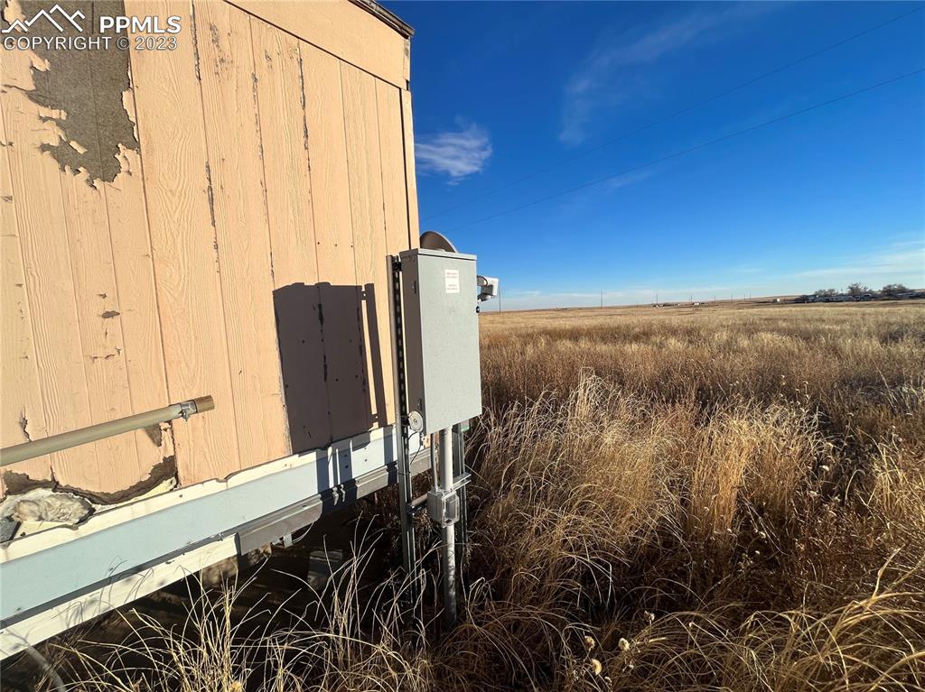 9350 Bowen Lane Yoder, CO 80864 - Photo 8 of 8 a view of a balcony with chair and table