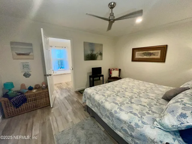 a bedroom with a large bed and a couch