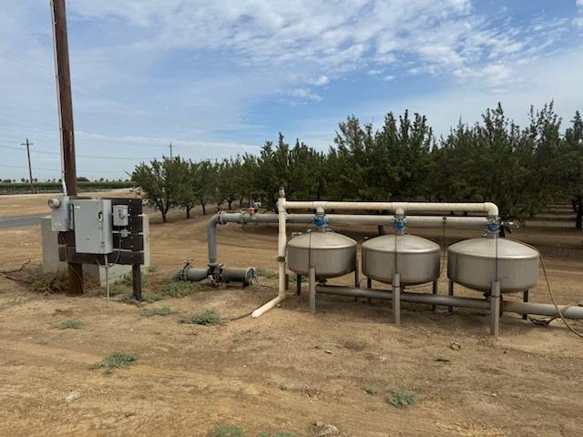 0 Orange Avenue Patterson, CA 95363 - Photo 2 of 4 a view of a chairs and table in a backyard