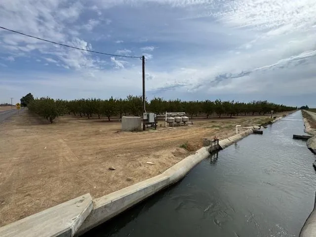 a view of a lake with a yard