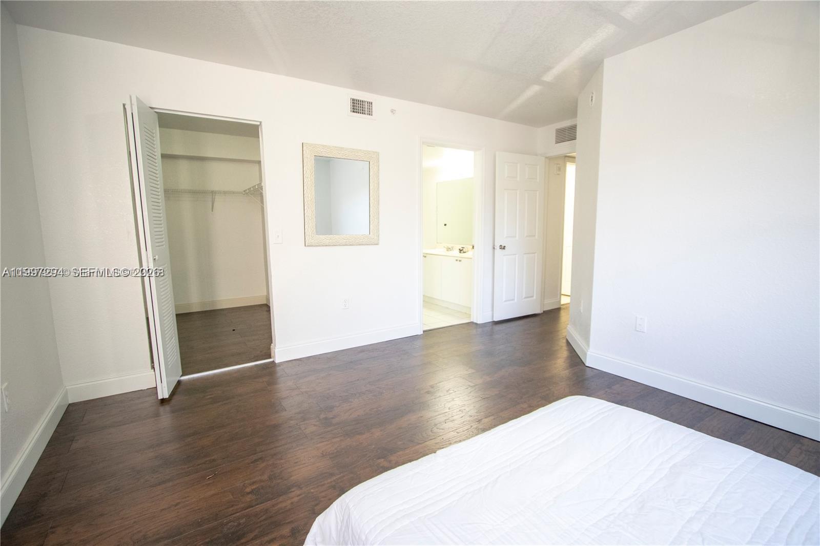 15470 Southwest 284th Street, Unit 3201 Homestead, FL 33033 - Photo 5 of 16 a big room with wooden floor and closet