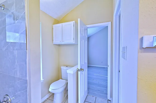 a bathroom with a toilet and a sink
