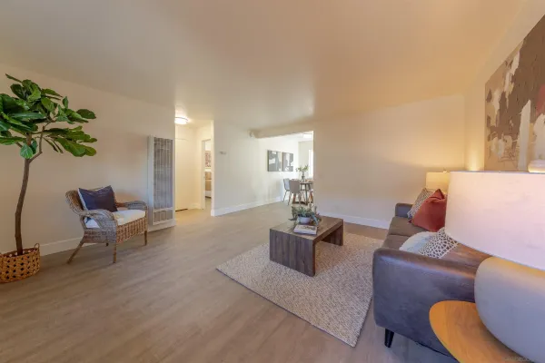 a kitchen with granite countertop stainless steel appliances a refrigerator microwave and stove