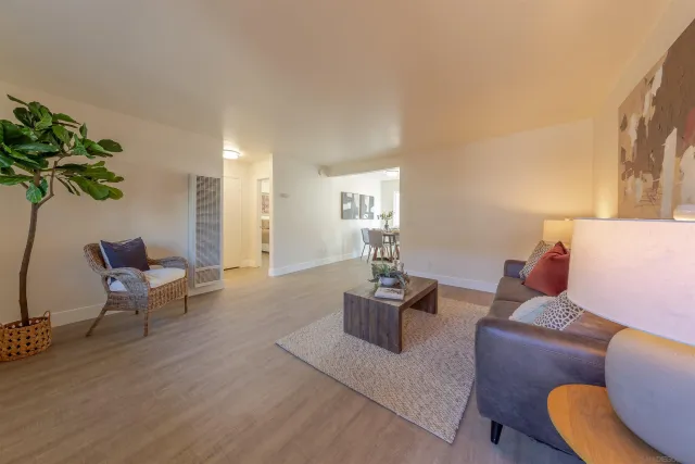 a kitchen with granite countertop stainless steel appliances a refrigerator microwave and stove