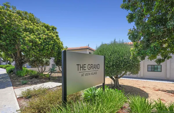 a sign broad in front of a white house