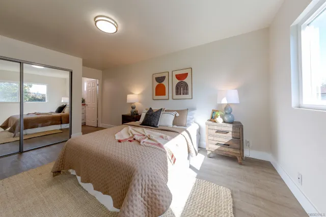 a view of a dining room with furniture and a window